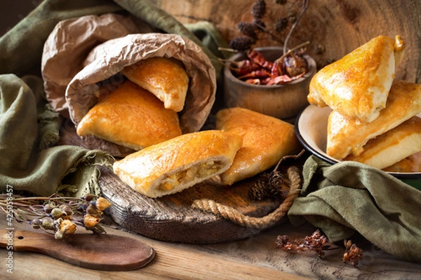 Fototapeta pies with cabbage and shortbread egg on wooden boards in a rustic style