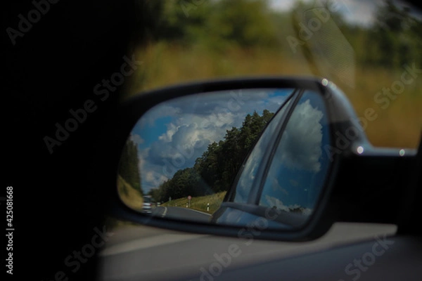 Fototapeta driving on a road , The cloud in the mirror 