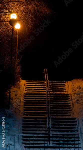 Fototapeta Stairs at night with lantern. 