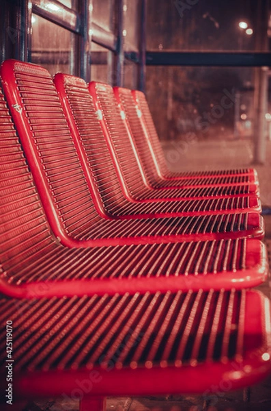 Obraz Red seats at the train station.