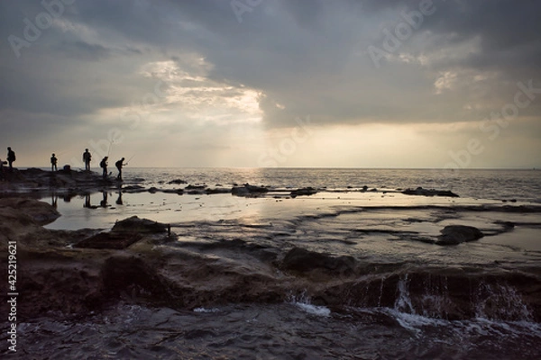 Obraz 江ノ島の西南端にある稚児ヶ淵の夕日