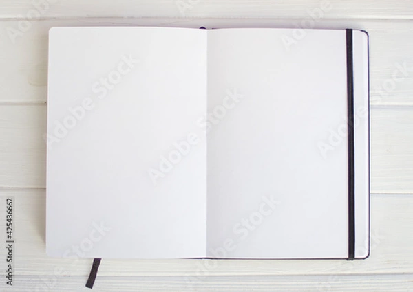 Obraz White empty sketchbook pages on white wood