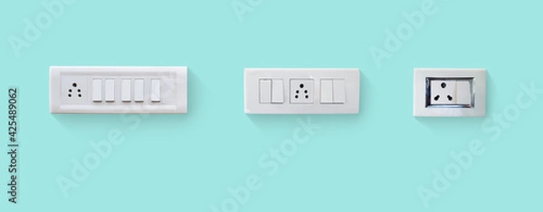 Fototapeta different size white electricity switch and socket board isolated