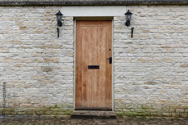 Obraz old wooden door of a house
