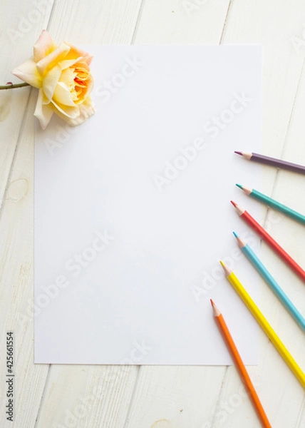 Obraz Mockup for A4 paper with single rose and drawing material