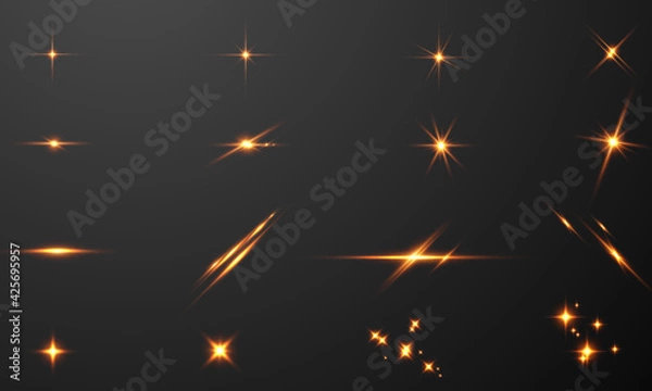 Fototapeta Set sparks glitter special light effect Glowing. Isolated on black transparent background.