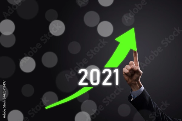 Fototapeta Plan business positive growth in year 2021 concept. Businessman plan and increase of positive indicators in his business, Growing up business concepts.