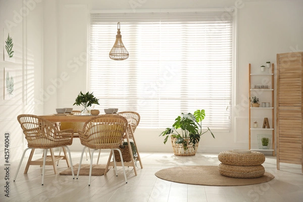 Fototapeta Stylish wooden dining table and chairs in room. Interior design