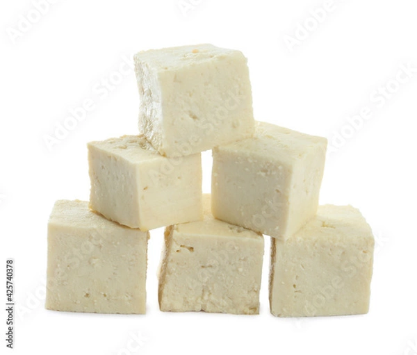 Fototapeta Pieces of delicious tofu on white background. Soybean curd