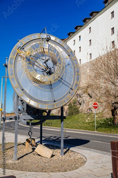 Fototapeta Kadan Astronomical Clock near Medieval castle, Tribute to Mikulas from Kadan Imperial clockmaker, the mechanical clock and astronomical dial, sunny day, Kadan, Czech Republic