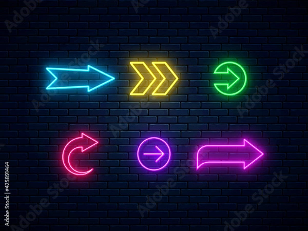 Fototapeta Neon arrow signs collection. Bright arrow pointer symbols on brick wall background. Set of colorful neon arrows, web icons. Banner design, bright advertising signboard elements. Vector illustration.