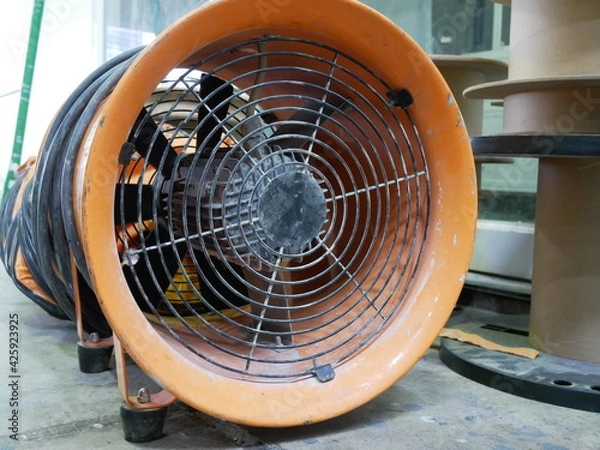 Obraz exhaust fan or portable ventilation fan at construction site.
