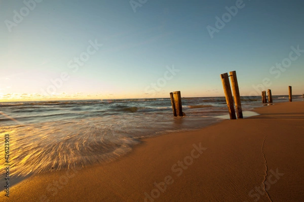 Fototapeta Long exposure of Lake Michigan Waves on the Beach during the Golden Sunset