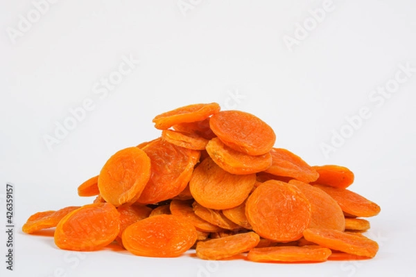 Obraz Dried apricots on a white background. Sun-dried fruits isolated on white.  Product for sale. Copy space. Free space for text