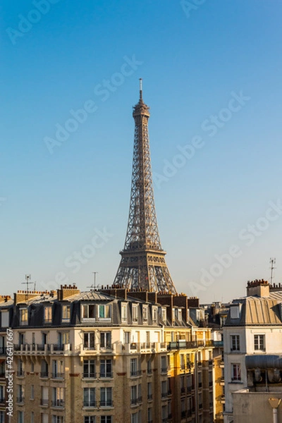 Fototapeta Eiffel tower behind the houses