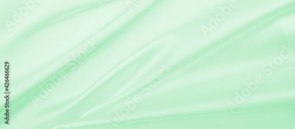 Fototapeta Smooth elegant green silk or satin luxury cloth texture as abstract background. Luxurious background design