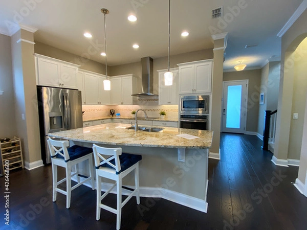 Fototapeta A nicely decorated cozy kitchen