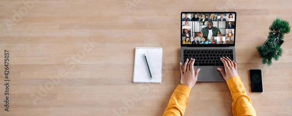 Fototapeta Online business briefing, virtual meeting. Panoramic photo of laptop screen with webcam shots of multi ethnic business partners communicates from home by a video conference, online webinar. Copy space