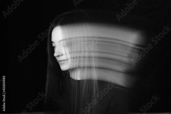 Obraz Blurred female portrait in the dark.