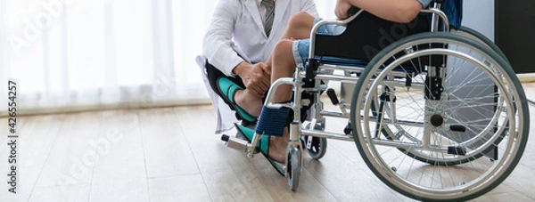 Fototapeta Orthopedic doctor checkup knee bone disability wheel chair patient polio person , Disability handicap person health concept