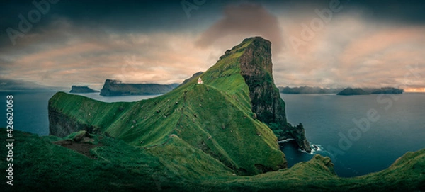 Fototapeta Panorama at Lighthouse with steep cliffs during sunset on Faroese island Kalsoy, Faroe Islands.
