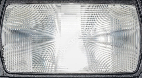 Fototapeta Flash light of a camera with colorful color foils photographed in the studio