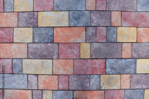 Fototapeta Cobblestone Pavers abstract mosaic background. Colored cobble stone texture. Close-up of street pavement
