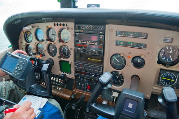 Fototapeta The instrument panel in the cockpit of the Cessna 182 RG Skylane in flight.