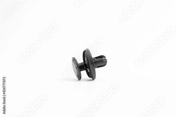 Fototapeta Black rivet plastic isolated on white background, used to fix workpiece to car
