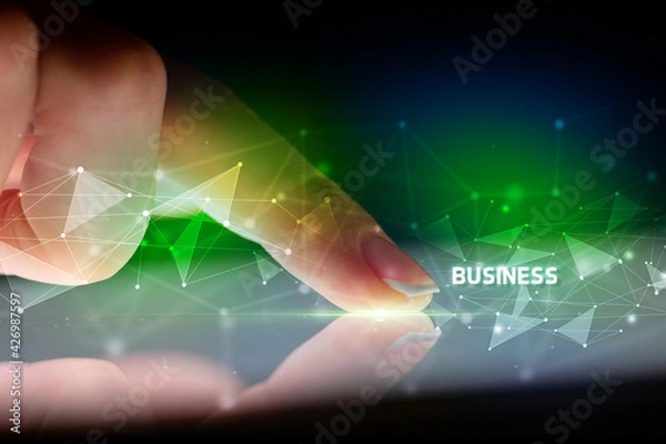 Fototapeta Finger touching tablet with business connection concept