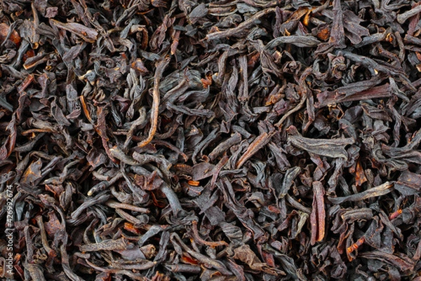 Fototapeta macro of black loose long leaf tea, loose tea  texture