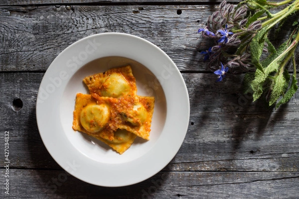 Obraz Homemade ravioli stuffed with borage and potatoes dressed with vegetarian ragout