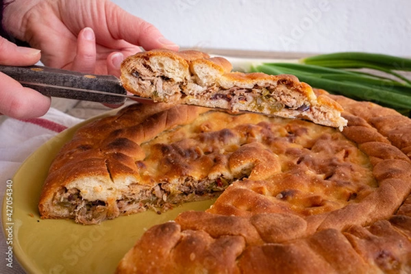 Obraz Close up of a slice of calzone - Traditional stuffed pizza of Puglia