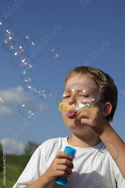 Fototapeta boy play in  bubbles