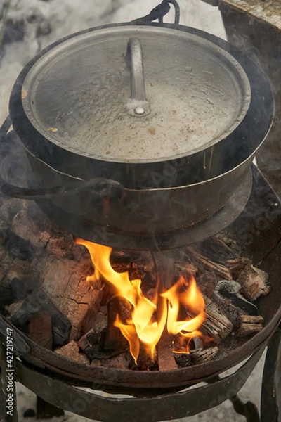Fototapeta Old pot on an open fire