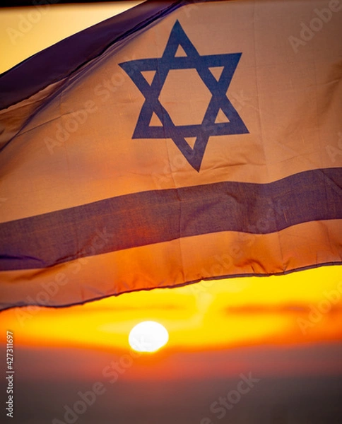 Obraz Israel flag with sky at sunset in the background