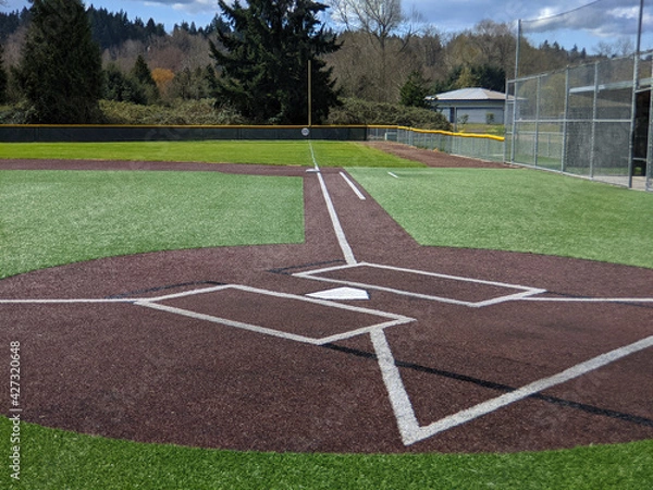 Fototapeta a large, empty baseball field on a bright, sunny day