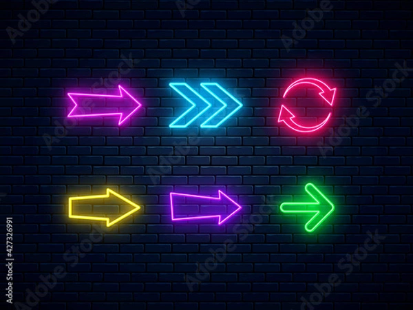 Fototapeta Neon arrow signs set. Bright arrow pointer symbols on brick wall background. Collection of colorful neon arrows, web icons. Banner design, bright advertising signboard elements. Vector illustration.