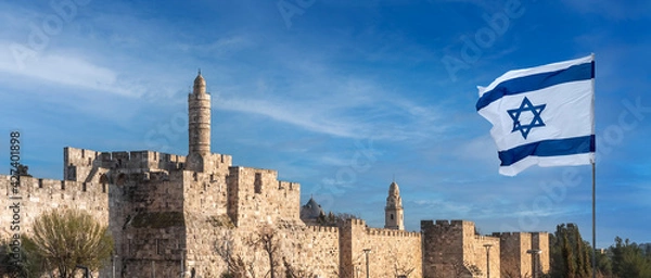 Fototapeta Panorama of Jerusalem Citadel near the Jaffa Gate with Tower of David, ancient fortress walls and Israeli flag