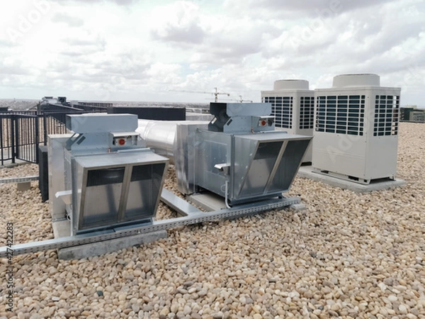 Obraz View of air ventilation ducts, extraction and insufflation, HVAC system, and exterior AC units on the building roof