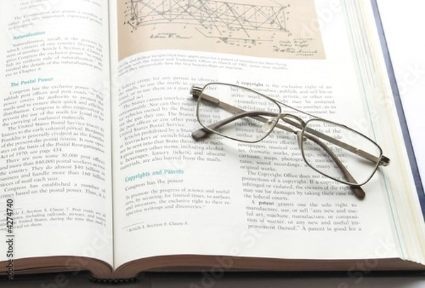 Fototapeta Glasses on book