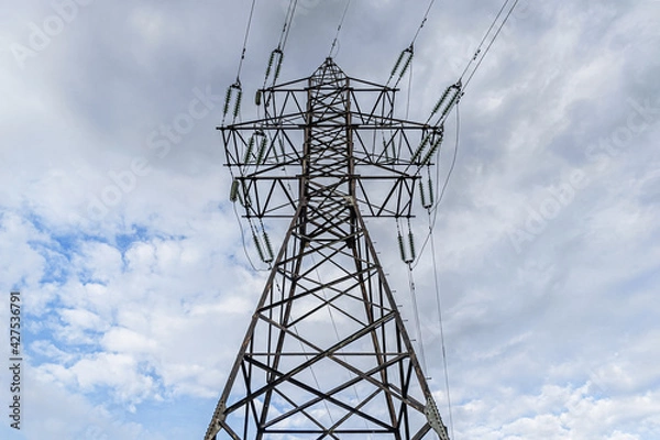 Fototapeta power pole against on a cloudy day