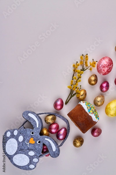 Fototapeta Vertical shot cartoon bunny with easter cake eggs and willow.