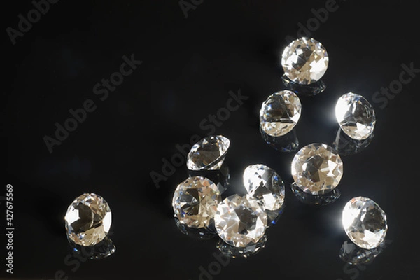 Fototapeta Several excellent pure diamonds with reflection on black mirror background close up view. Jewelry diamonds sale, invitation, action, discount banner, poster, card template copy space