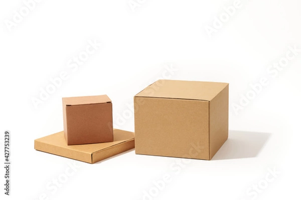 Obraz Close-up shot of different shaped cardboard boxes isolated on white background