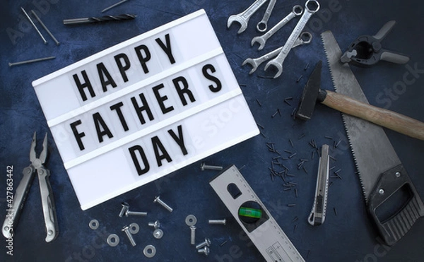 Fototapeta Happy Father´s Day background with Various tools on a dark blue background, Top view.