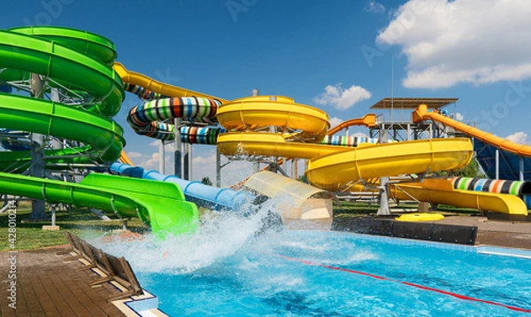 Obraz water park, bright multi-colored slides with a pool, a water park on a summer day