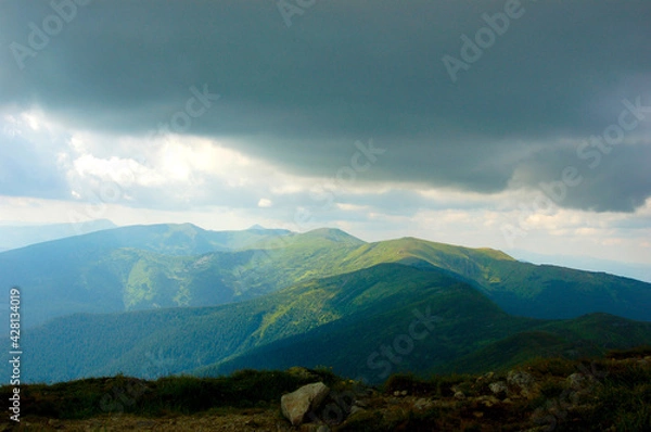 Fototapeta clouds over the mountains