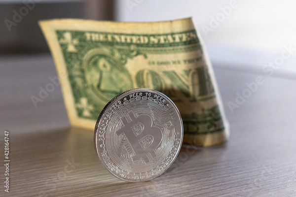 Obraz bitcoin coin on a dollar background