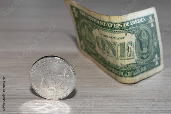 Obraz bitcoin coin on a dollar background